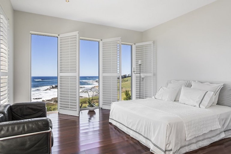 Saltwater Sunrise bedroom opening out to ocean views
