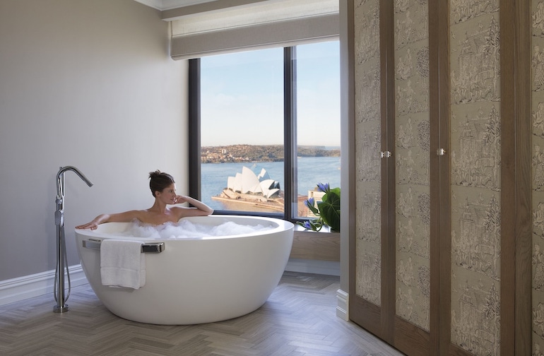 Deep soaking bath tub with a view of the Sydney Opera House at the Four Seasons Hotel Sydney