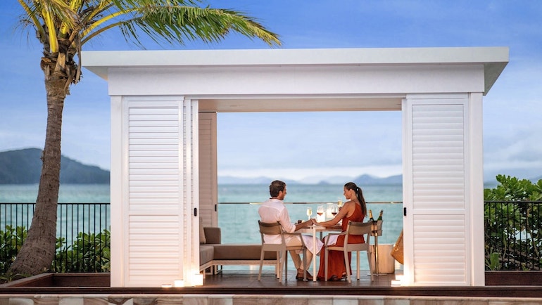 Couple dining with ocean views at InterContinental Hayman Island Resort