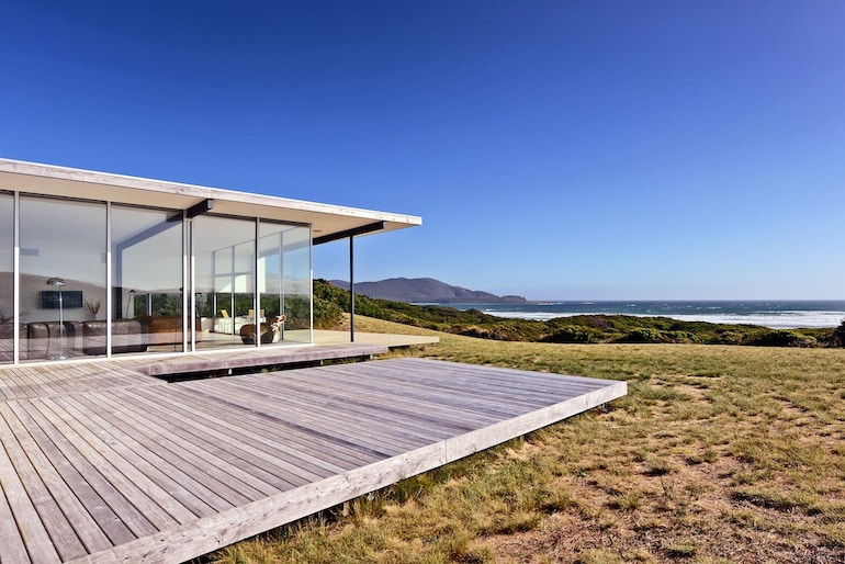 Cloudy Bay Beach House's spacious deck with ocean view