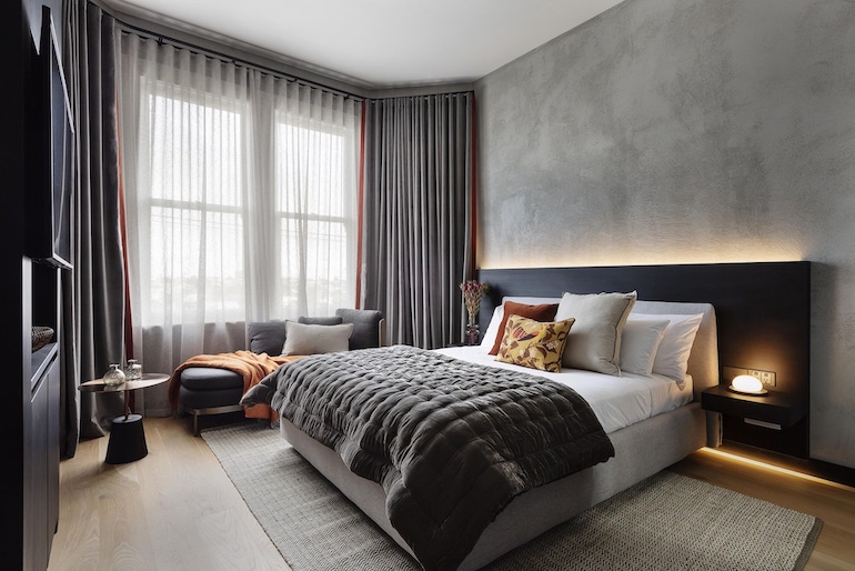 Hotel Fitzroy curated by Fable's rooms have sophisticated rooms with predominantly monochromatic colour palettes accented with warm splashes of colour.