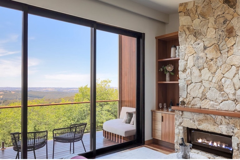 Suite with fireplace and furnished balcony at Sequoia Lodge