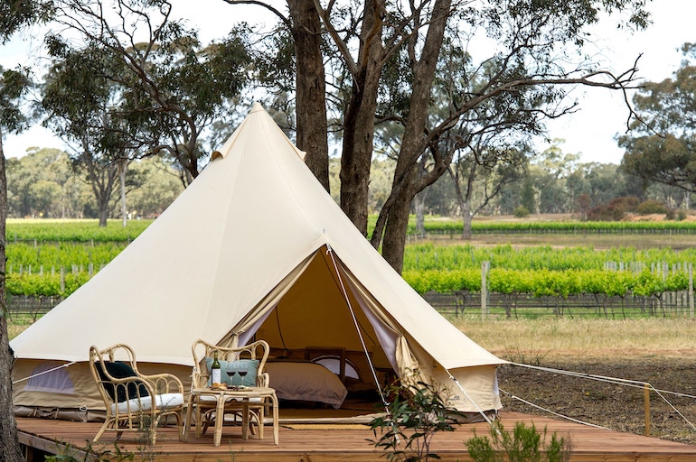 Balgownie Estate Winery's glamping tent set on a wooden platform with vineyard views.