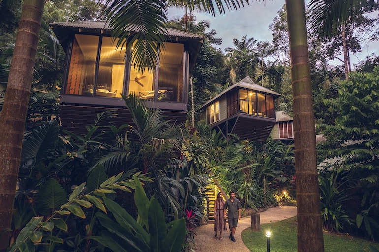 Couple walking hand in hand at Daintree Ecolodge