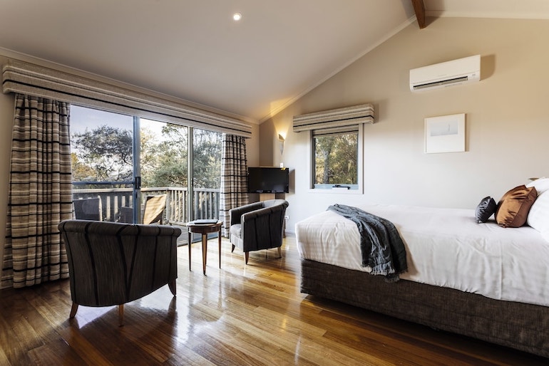 Freycinet Lodge's comfy suite with furnished private balcony