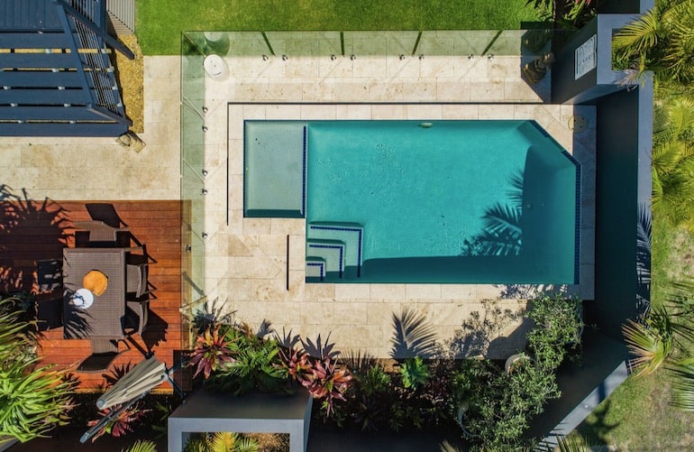 Aerial view of Aloha Byron Bay's outdoor pool and outdoor dining area