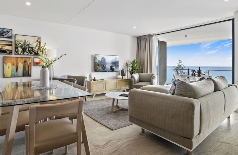 Living and dining are inside one of Breeze Mooloolaba's guest rooms