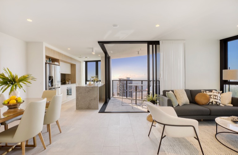 Living room and dining area inside one of Vue Broadbeach's apartments