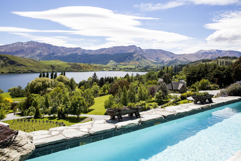 Stoneridge Estate's outdoor lap pool with garden views