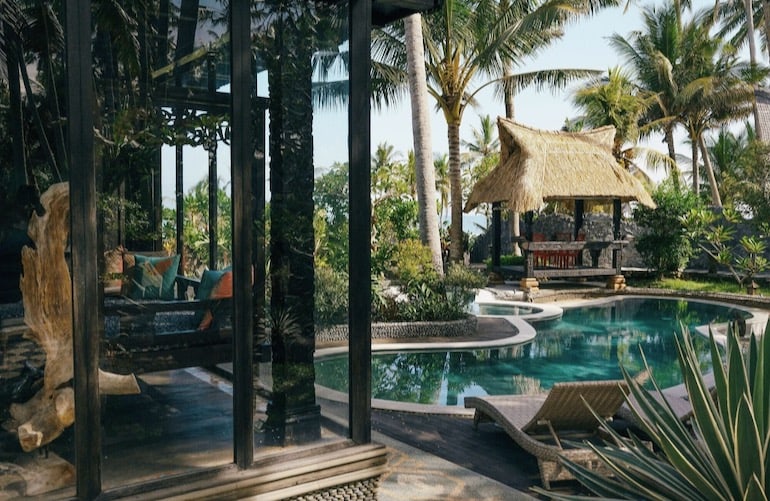 Traditional Balinese design style, outdoor pool, and gazebo at Most Exotic Beachfront Villa Keong
