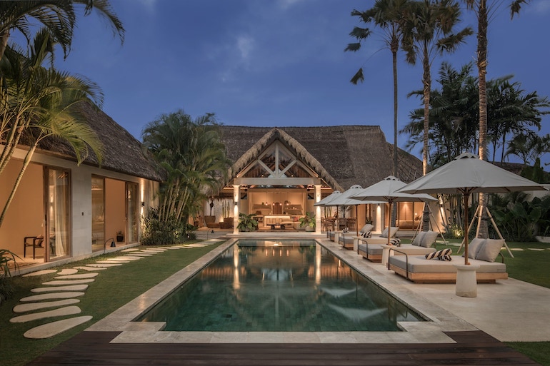 Outdoor pool and shaded daybeds at Villa Massilia