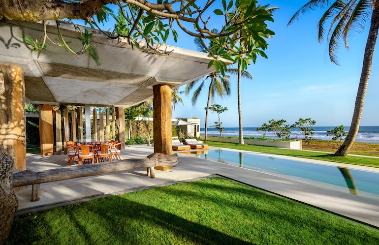 Lap pool and semi-outdoor dining area at Villa Vedas