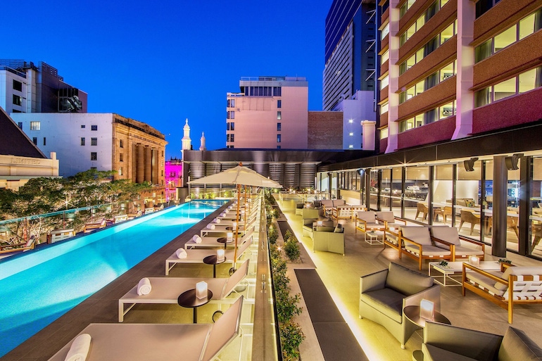 the infinity lap pool, poolside loungers at Hyatt Regency Brisbane