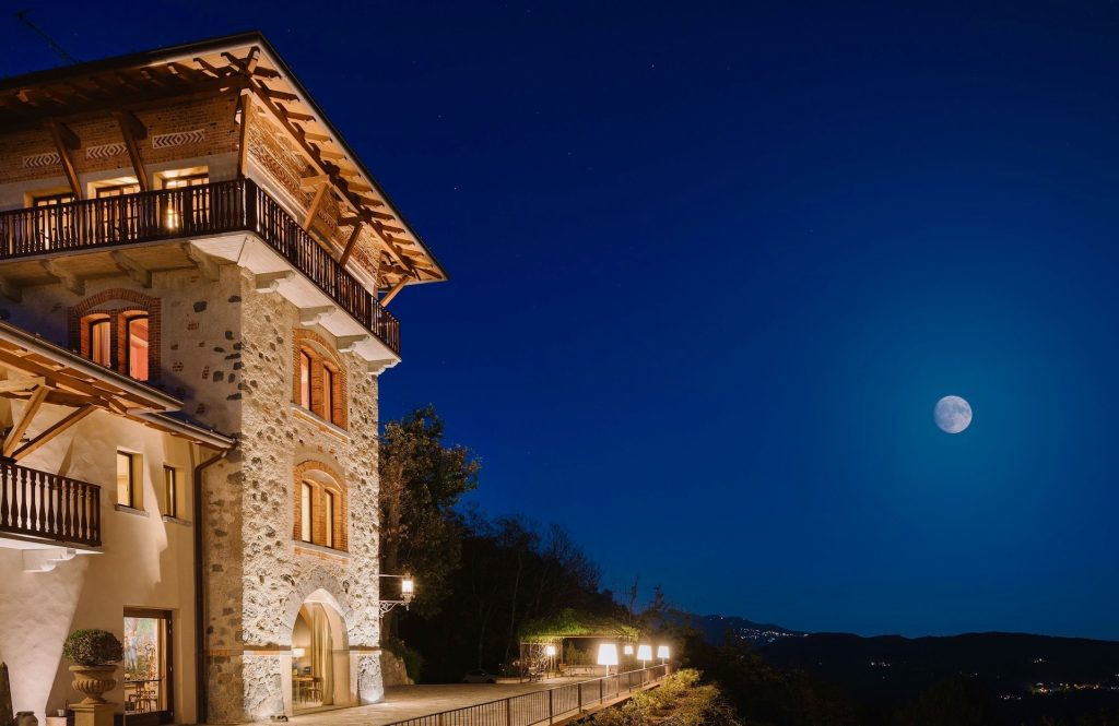 View of the full moon in the night sky from the exterior of Tenuta De L'Annunziata in Italy
