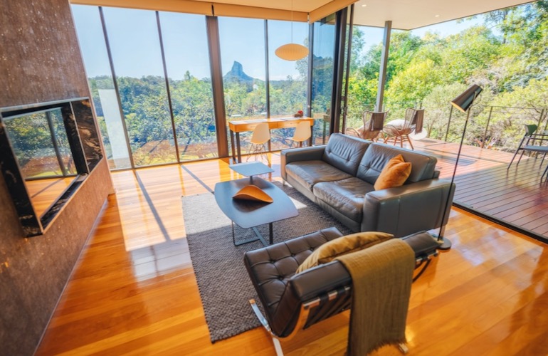 Light-filled living room and views inside Glass on Glasshouse