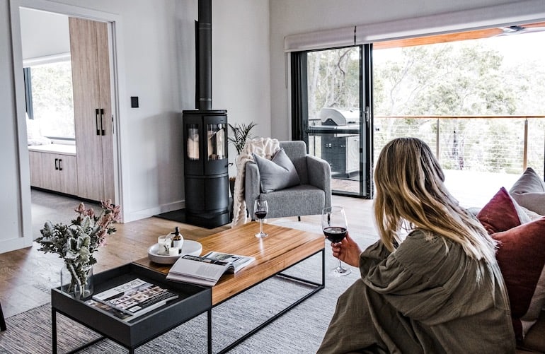 Bina Maya Yallingup Escape's minimalist interiors with fireplace and bushland views